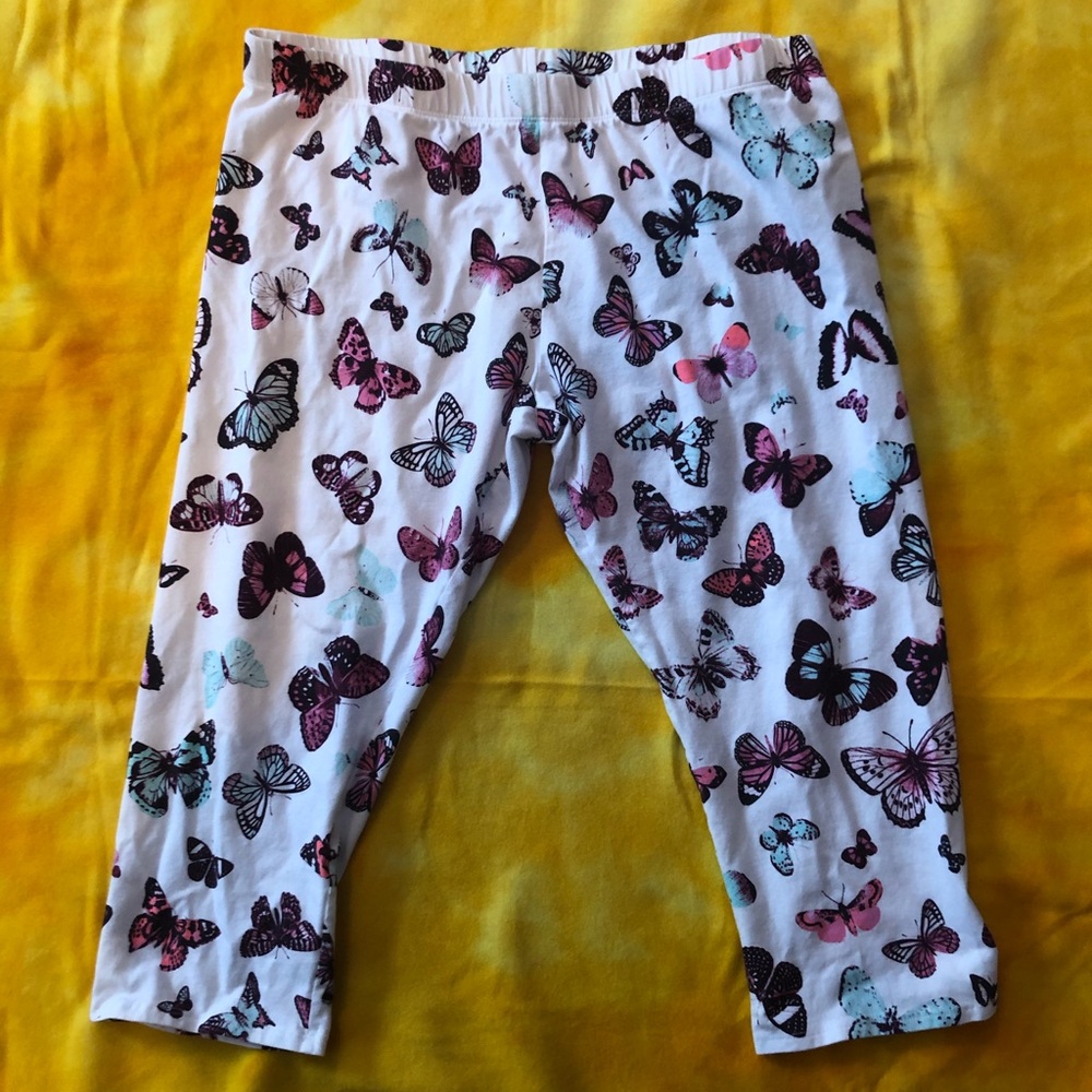 white leggings with a butterflies pattern